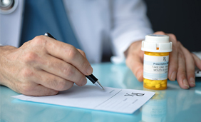 doctor holding a pill bottle