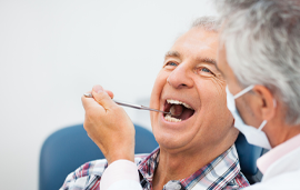 man getting a dental exam